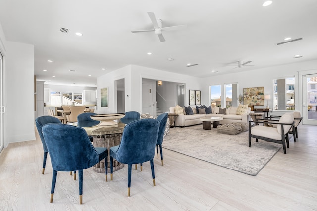 dining space featuring ceiling fan and light hardwood / wood-style floors