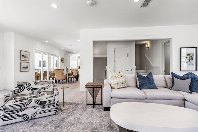 living room with light hardwood / wood-style flooring