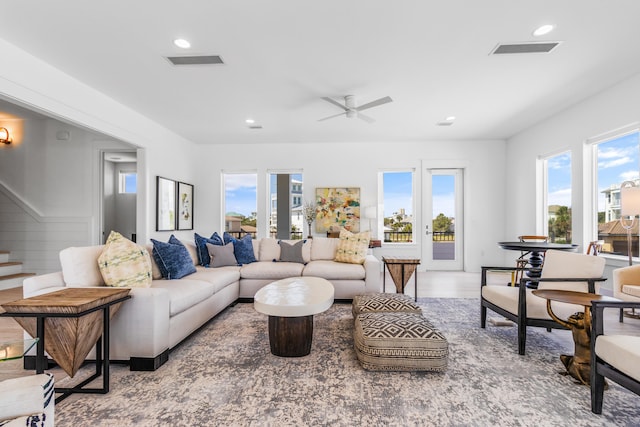 living room with plenty of natural light, ceiling fan, and hardwood / wood-style flooring