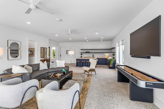 living room featuring ceiling fan