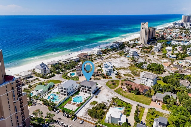 bird's eye view with a beach view and a water view