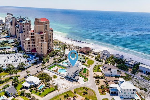 birds eye view of property featuring a water view and a view of the beach