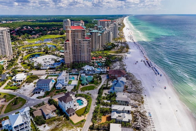 aerial view with a water view and a view of the beach