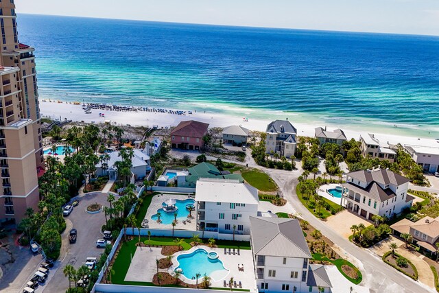 bird's eye view with a water view and a view of the beach