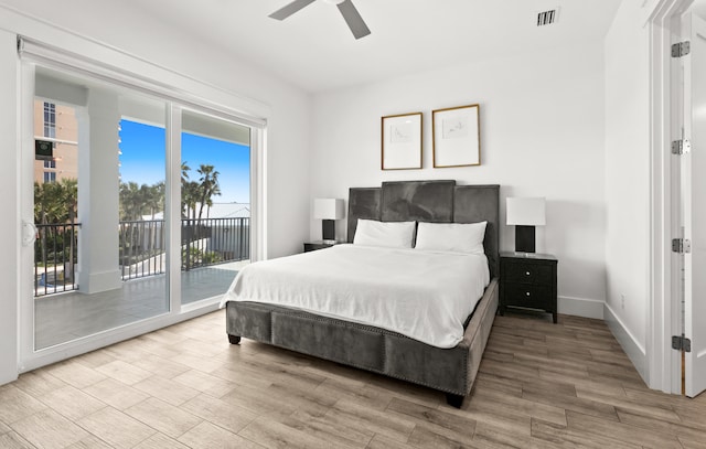 bedroom featuring light hardwood / wood-style floors, ceiling fan, and access to exterior