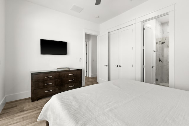 bedroom with light hardwood / wood-style flooring, connected bathroom, and ceiling fan