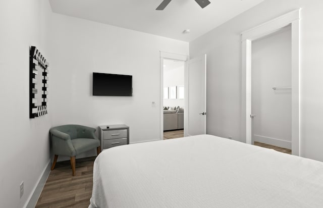 bedroom featuring dark hardwood / wood-style flooring and ceiling fan