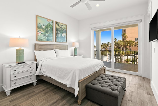 bedroom featuring dark hardwood / wood-style flooring, ceiling fan, and access to outside