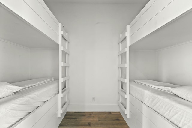 spacious closet featuring dark wood-type flooring