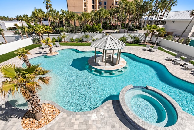 view of swimming pool featuring a patio area