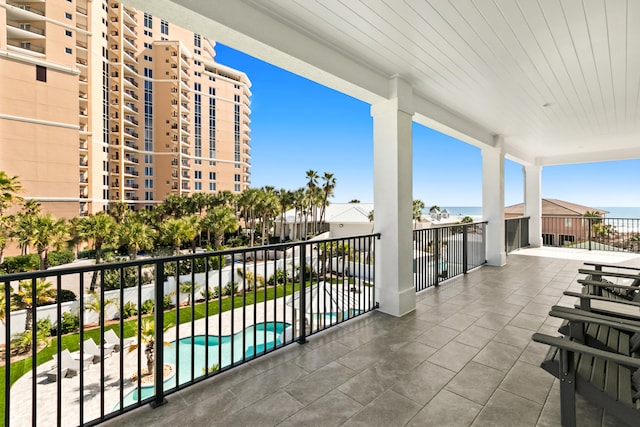 balcony featuring a community pool