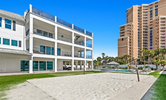 view of property's community with a patio area and a swimming pool