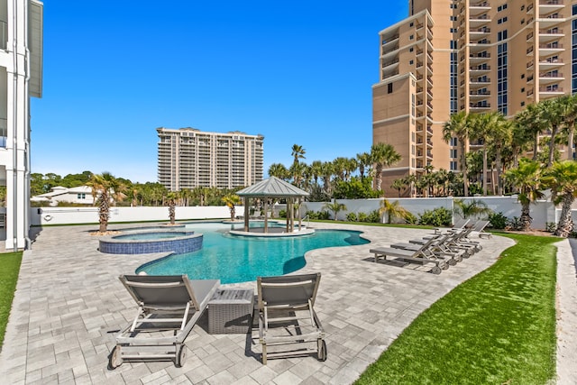 view of swimming pool with a patio, a hot tub, and a gazebo