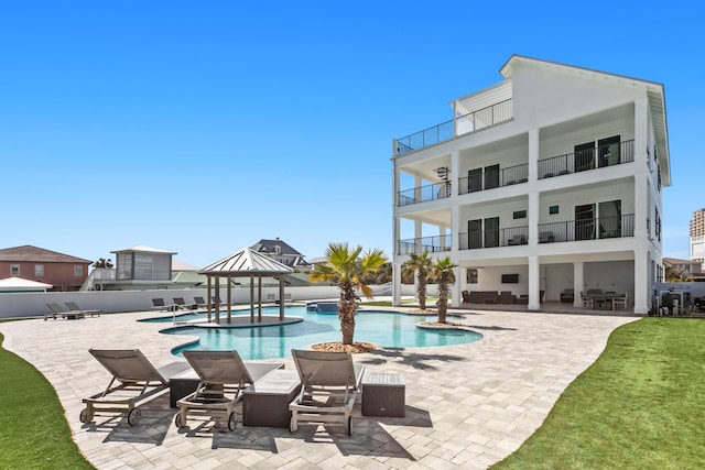 view of swimming pool featuring a gazebo and a patio area