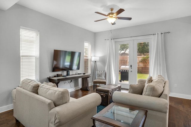 living room with french doors, dark wood-type flooring, and ceiling fan