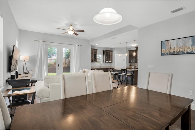 dining room with french doors and ceiling fan