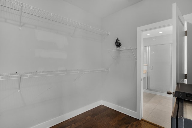 spacious closet with tile floors