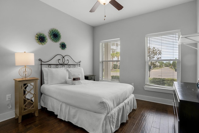 bedroom with ceiling fan and dark hardwood / wood-style flooring