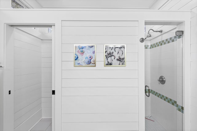 bathroom with a tile shower