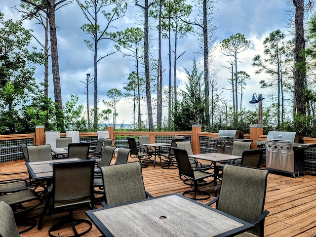 wooden terrace with a grill