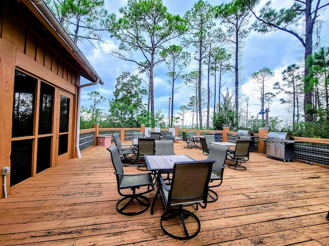 wooden deck featuring grilling area