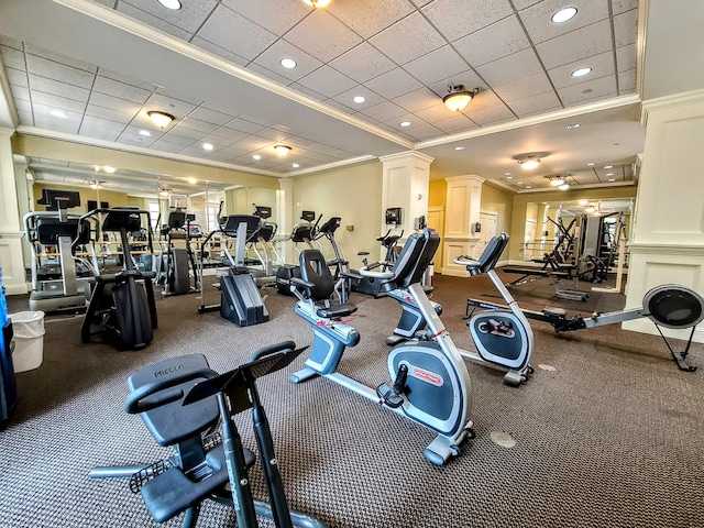 gym with a paneled ceiling and crown molding