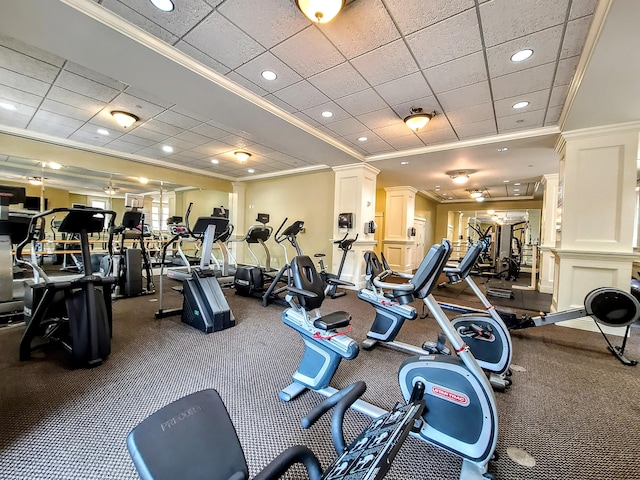 exercise room featuring crown molding and a drop ceiling