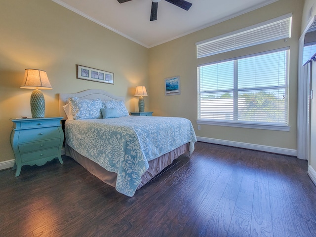 bedroom with ornamental molding, ceiling fan, and dark hardwood / wood-style floors