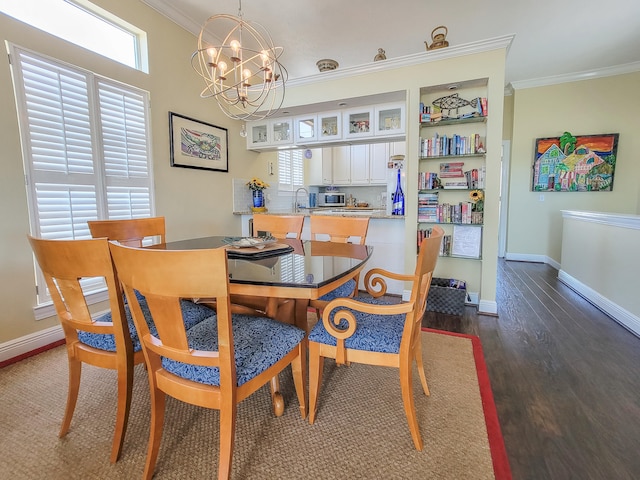 dining room featuring a chandelier, crown molding, and dark wood-type flooring