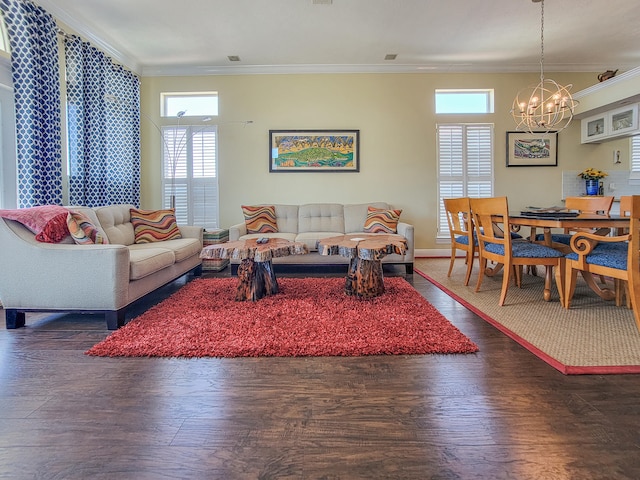 living room featuring a chandelier, crown molding, and dark hardwood / wood-style floors