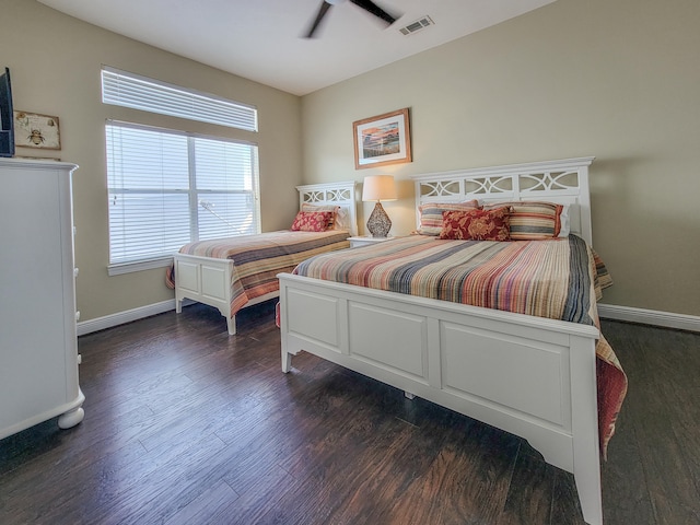 bedroom featuring ceiling fan and dark wood-type flooring