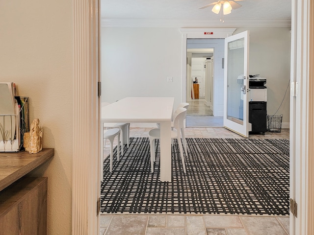 interior space with light tile flooring and ornamental molding