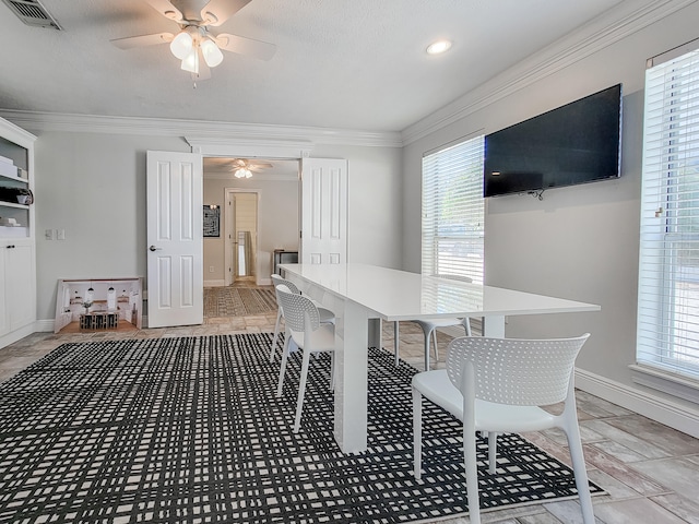 dining room with plenty of natural light, ceiling fan, and light tile floors