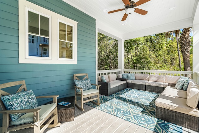 wooden terrace with outdoor lounge area and ceiling fan