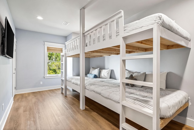 bedroom featuring wood-type flooring