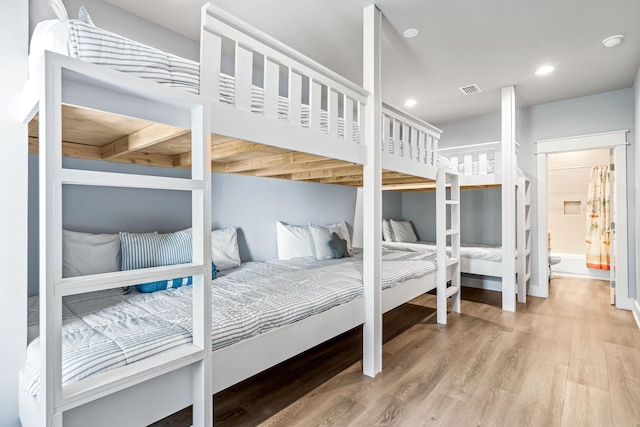 bedroom with wood-type flooring