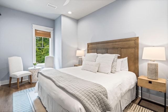 bedroom with hardwood / wood-style floors