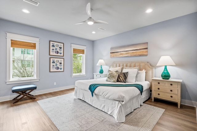 bedroom with ceiling fan and hardwood / wood-style flooring