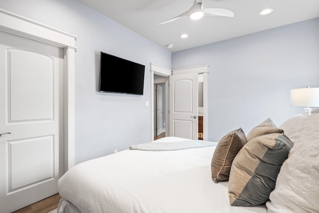 bedroom with wood-type flooring and ceiling fan