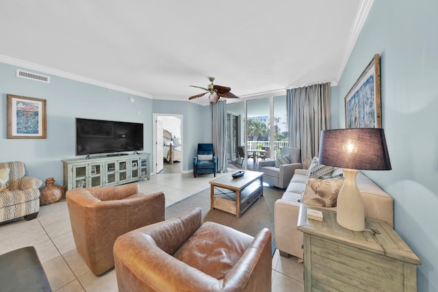 tiled living room with ornamental molding and ceiling fan