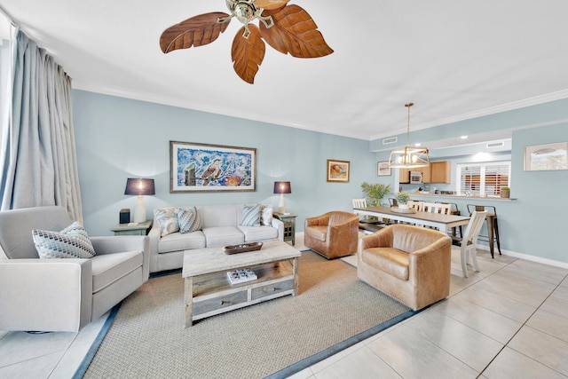 tiled living room with ornamental molding and ceiling fan with notable chandelier