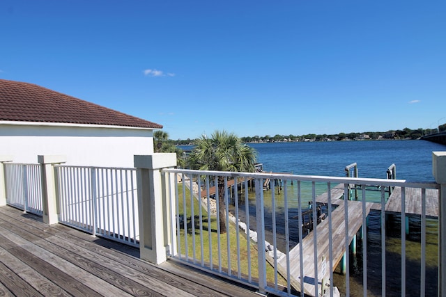 wooden terrace with a water view