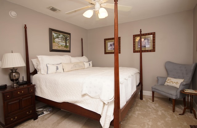 bedroom featuring light carpet and ceiling fan