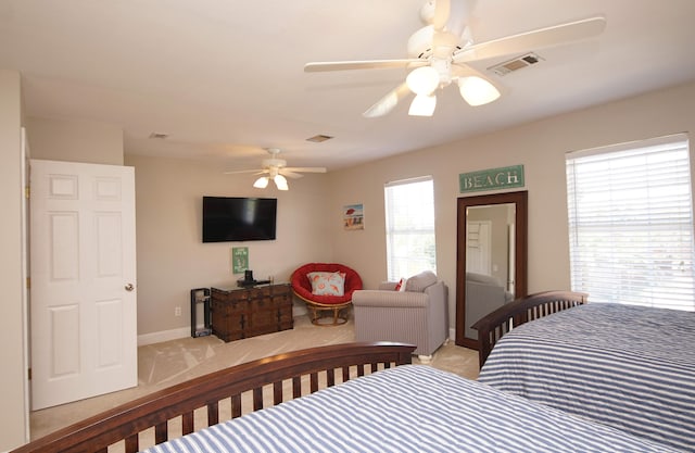 bedroom with light colored carpet and ceiling fan