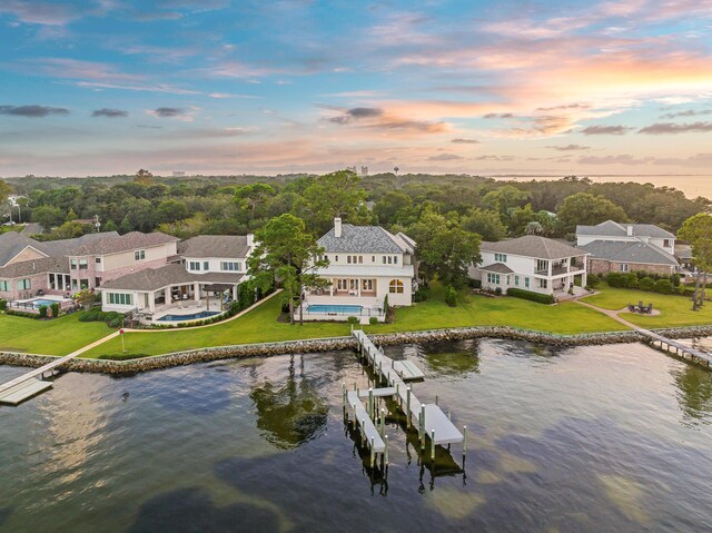 aerial view at dusk with a water view