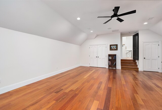 bonus room with lofted ceiling, hardwood / wood-style flooring, and ceiling fan