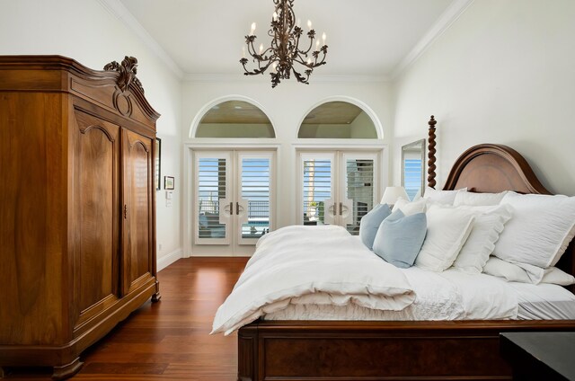 bedroom featuring ornamental molding, dark hardwood / wood-style flooring, access to exterior, and french doors