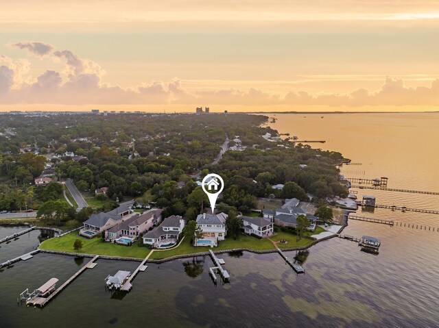 aerial view at dusk with a water view