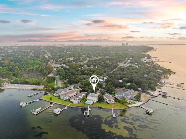 aerial view at dusk with a water view