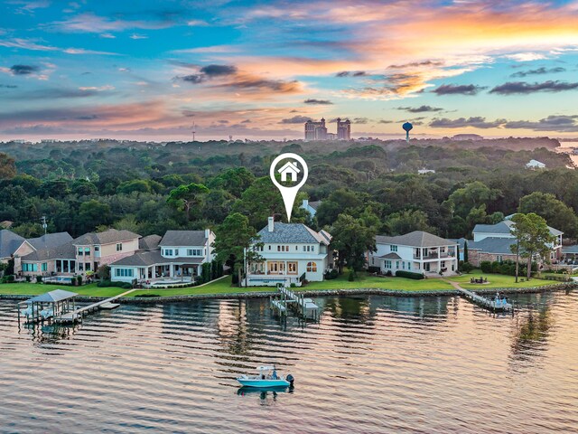 aerial view at dusk with a water view